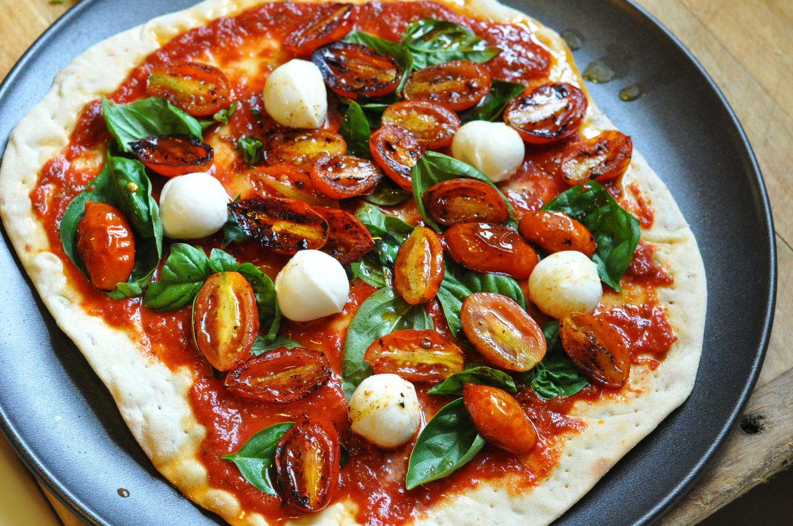 Homemade pizza with oregano oil